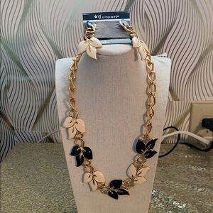 Elegant Gold Necklace with Black and Cream Leaves